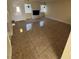 Spacious living room featuring a decorative fireplace and tile floors at 2655 Aracatuba Ave, Las Vegas, NV 89121