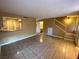 Open-concept living room with tile floors and staircase at 2655 Aracatuba Ave, Las Vegas, NV 89121