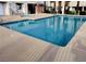 Community pool and spa surrounded by a concrete deck at 2655 Aracatuba Ave, Las Vegas, NV 89121
