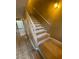 Carpeted staircase features a white railing and access to multiple floors at 2655 Aracatuba Ave, Las Vegas, NV 89121