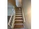 Staircase with wood treads and white risers features a modern railing at 2655 Aracatuba Ave, Las Vegas, NV 89121