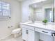 Bathroom featuring a white vanity, ample lighting, and walk-in shower at 2728 Tricase St, Henderson, NV 89044