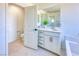 Well-lit bathroom featuring double sinks, and walk-in shower with tub at 2728 Tricase St, Henderson, NV 89044