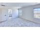 Bedroom with neutral carpet and mountain views, adjacent to a bright en-suite bathroom at 2728 Tricase St, Henderson, NV 89044