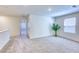 Open loft area with plush carpeting and natural light offers versatile living space at 2728 Tricase St, Henderson, NV 89044