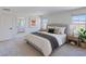 Calming main bedroom with mountain views, neutral carpet, and a doorway to the ensuite bathroom at 2728 Tricase St, Henderson, NV 89044
