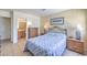 Cozy bedroom with neutral decor and an ensuite bathroom at 2738 Sandalwood Ave, Henderson, NV 89074