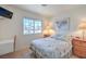 Bright bedroom featuring a window, floral bedding, and wood furniture at 2738 Sandalwood Ave, Henderson, NV 89074