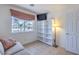 Cozy bedroom features built-in shelving, a window with shade, and neutral decor at 2738 Sandalwood Ave, Henderson, NV 89074