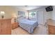 Bedroom with bedside tables, lamps, tile floors and a large window for natural light at 2738 Sandalwood Ave, Henderson, NV 89074