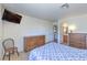 Bright bedroom with built in drawers, tile floors, and an adjacent bathroom at 2738 Sandalwood Ave, Henderson, NV 89074