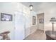 Clean entryway with double doors, neutral walls, and decorative mirror at 2738 Sandalwood Ave, Henderson, NV 89074