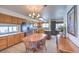Eat-in kitchen features wooden cabinets, granite counters and a stainless steel refrigerator at 2738 Sandalwood Ave, Henderson, NV 89074