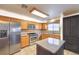 Modern kitchen with stainless steel appliances, granite countertops, and ample storage at 2738 Sandalwood Ave, Henderson, NV 89074