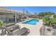 Relaxing backyard features a private pool with lounge chairs and a covered patio, perfect for outdoor entertaining at 2738 Sandalwood Ave, Henderson, NV 89074