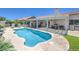 An inviting pool area features a covered patio, lounge chairs, and well-maintained landscaping at 2738 Sandalwood Ave, Henderson, NV 89074