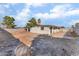 Large backyard featuring desert landscaping and mature trees at 2878 El Cajon St, Las Vegas, NV 89169