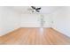 Bright bedroom features wood-look floors, ceiling fan, and fresh white walls at 2878 El Cajon St, Las Vegas, NV 89169