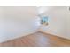 Cozy bedroom with a window and light wood-look flooring at 2878 El Cajon St, Las Vegas, NV 89169