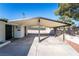 Exterior shot of home featuring a covered carport and low maintenance desert landscaping at 2878 El Cajon St, Las Vegas, NV 89169