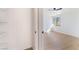 View from closet to bedroom with light wood-look flooring and window at 2878 El Cajon St, Las Vegas, NV 89169