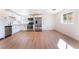 Open kitchen and living area featuring modern appliances, ample storage, and hardwood floors at 2878 El Cajon St, Las Vegas, NV 89169
