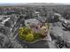 Striking monochrome aerial view highlights home with dark solar panels and landscaping at 3004 Astoria Pines Cir, Las Vegas, NV 89107