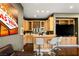 Living room bar area with wine storage, custom cabinets, and comfortable seating at 3004 Astoria Pines Cir, Las Vegas, NV 89107