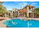 Backyard oasis featuring a sparkling pool, spa, and inviting patio with spiral staircase at 3004 Astoria Pines Cir, Las Vegas, NV 89107