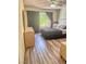 Stylish bedroom with contemporary decor, hardwood floors, and a bright window at 3101 Casey Dr # 204, Las Vegas, NV 89120