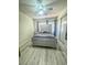 Cozy bedroom featuring a ceiling fan, natural light, and a comfortable bed at 3101 Casey Dr # 204, Las Vegas, NV 89120