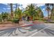 Charming clubhouse entrance framed by palm trees and meticulously maintained landscaping at 3101 Casey Dr # 204, Las Vegas, NV 89120