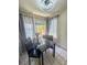Stylish dining area featuring a marble table, chairs, and large windows that bring in natural light at 3101 Casey Dr # 204, Las Vegas, NV 89120