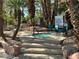 A community hot tub on a concrete platform, surrounded by mature trees and landscaping at 3101 Casey Dr # 204, Las Vegas, NV 89120
