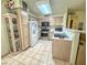 Traditional kitchen featuring tile flooring, stainless steel appliances, and bright lighting at 3101 Casey Dr # 204, Las Vegas, NV 89120