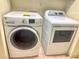 Laundry room with standard white washer and dryer units on tile flooring at 3101 Casey Dr # 204, Las Vegas, NV 89120