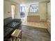 Bright living room featuring a sectional sofa, neutral walls, and tiled floors that flow into an adjacent room at 3101 Casey Dr # 204, Las Vegas, NV 89120