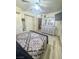 Spacious main bedroom with wood floors, sliding closet doors, dresser and TV at 3101 Casey Dr # 204, Las Vegas, NV 89120