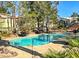 Inviting pool surrounded by lush greenery and lounge chairs, creating a perfect oasis at 3101 Casey Dr # 204, Las Vegas, NV 89120