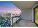 Enjoy city views from this balcony with glass railings and neutral tile flooring at 322 Karen Ave # 2501, Las Vegas, NV 89109