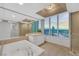 Luxury primary bathroom with soaking tub, separate shower, dual vanity, and city views at 322 Karen Ave # 2501, Las Vegas, NV 89109