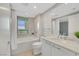 A well-lit bathroom with a soaking tub, shower, and views of the cityscape at 322 Karen Ave # 2501, Las Vegas, NV 89109