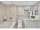 Bright bathroom featuring a bathtub, shower, and a large sink with vanity at 322 Karen Ave # 2501, Las Vegas, NV 89109