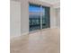 Bedroom area featuring tile flooring and balcony access with city views at 322 Karen Ave # 2501, Las Vegas, NV 89109