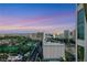 Expansive city view featuring a golf course and the iconic Las Vegas skyline at dusk at 322 Karen Ave # 2501, Las Vegas, NV 89109