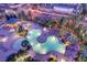 Aerial view of a resort-style pool surrounded by palm trees, rocks, and a covered seating area at 322 Karen Ave # 2501, Las Vegas, NV 89109
