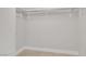 Walk-in closet featuring neutral walls, carpet flooring, and storage shelves at 322 Karen Ave # 2501, Las Vegas, NV 89109