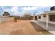Spacious backyard features a large, empty space with a covered patio and a block wall at 3309 Marionette Ave, Las Vegas, NV 89101