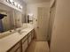 Neutral-toned bathroom featuring a vanity with an extended counter, framed mirror, and simple fixtures at 3550 Bay Sands Dr # 2070, Laughlin, NV 89029