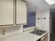 Practical kitchen layout with a double sink, cabinets, and easy living area access at 3550 Bay Sands Dr # 2070, Laughlin, NV 89029